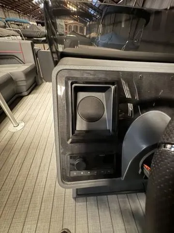 Slide: The Image of 2023 Manitou Explore 22 Max Bench interior with modern dashboard controls. - 20