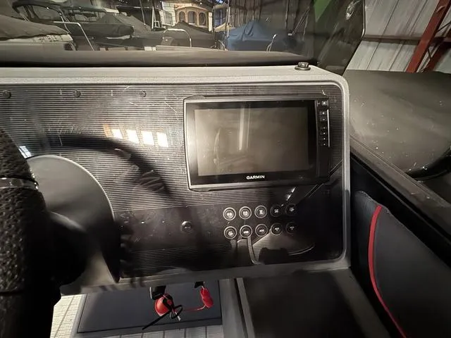 Slide: The Image of Control panel of 2023 Manitou Explore 22 Max Bench with Garmin display. - 21