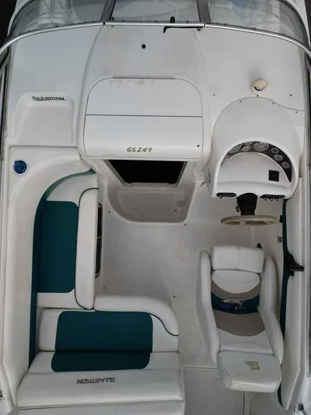 Slide: The Image of 2000 Glastron 249 boat interior with seating and steering console, top view. - 16