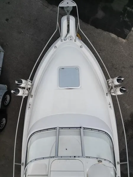 Slide: The Image of Top view of a 2000 Glastron 249 boat, showcasing its deck and hatch. - 17