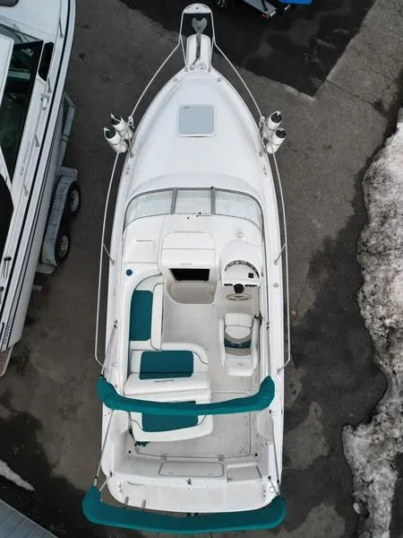 Slide: The Image of Overhead view of 2000 Glastron 249 boat with teal seating and white deck. - 4