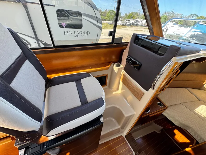 Slide: The Image of Interior of 2016 Cutwater C-28 boat showing seating and dashboard details. - 3