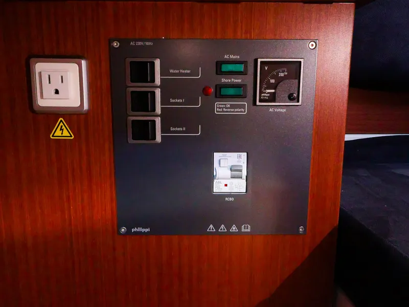 Slide: The Image of Electrical control panel on a 2018 Hanse 315 yacht interior. - 20