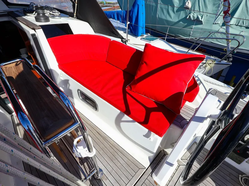 Slide: The Image of 2018 Hanse 315 yacht cockpit with vibrant red seating and modern design. - 6