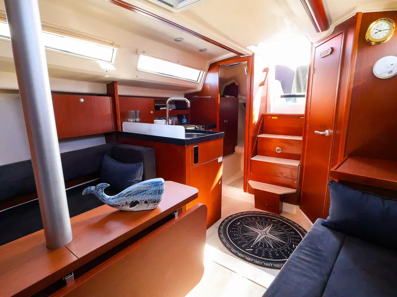 Slide: The Image of Interior of 2018 Hanse 315 yacht with wooden finish and modern amenities. - 9