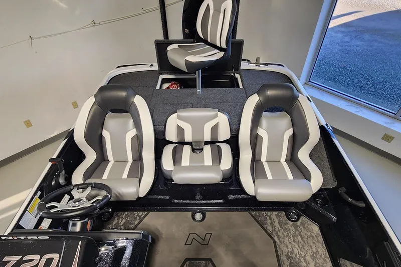 Slide: The Image of 2025 Nitro Z20 XL boat interior with modern seating and steering wheel. - 11