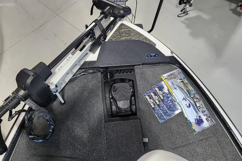 Slide: The Image of 2025 Nitro Z20 XL boat deck with trolling motor and brochures. - 4