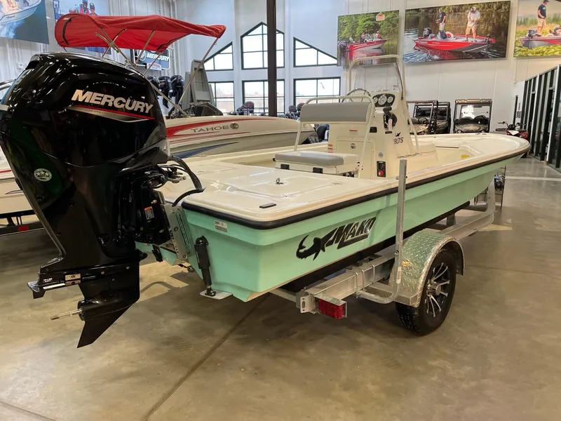 Slide: The Image of 2025 Mako 18 LTS boat with Mercury engine on display in showroom. - 3