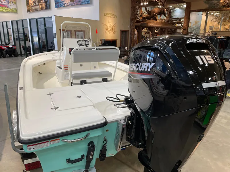 Slide: The Image of 2025 Mako 18 LTS boat with Mercury 115 engine in showroom. - 4