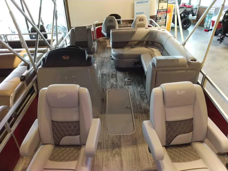 Slide: The Image of 2025 Ranger Reata 223F pontoon boat interior with plush seating and modern design. - 3