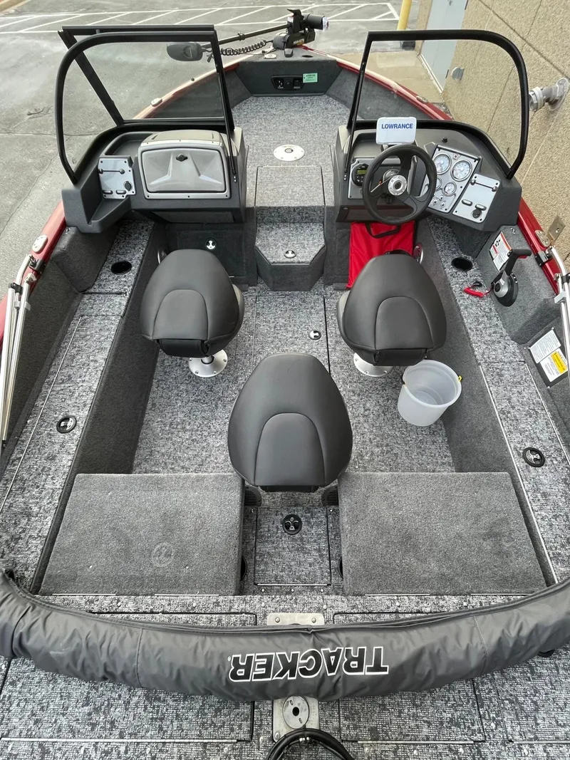 Slide: The Image of 2025 Tracker Pro Guide V-175 Combo boat interior with seating and steering console. - 3