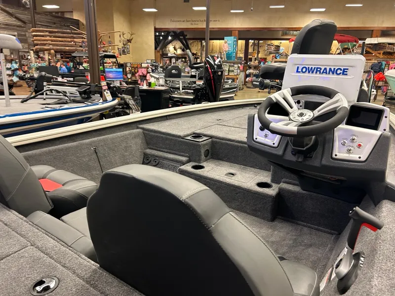 Slide: The Image of 2025 Tracker Pro Team 195 Tournament Edition boat interior with steering console and seating. - 4