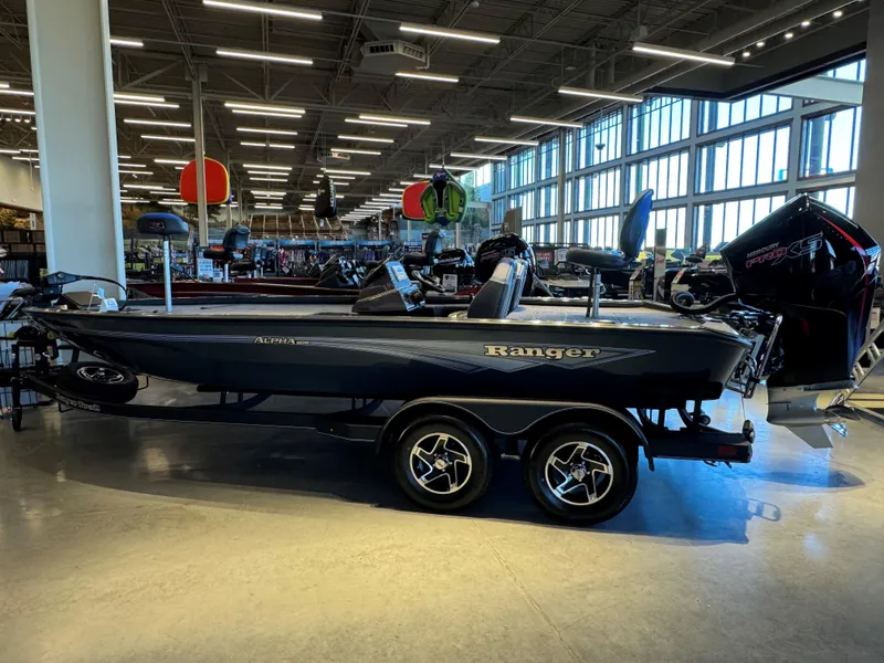 The Image of 2025 Ranger ALPHA 208 boat displayed in a showroom with modern lighting. - 0