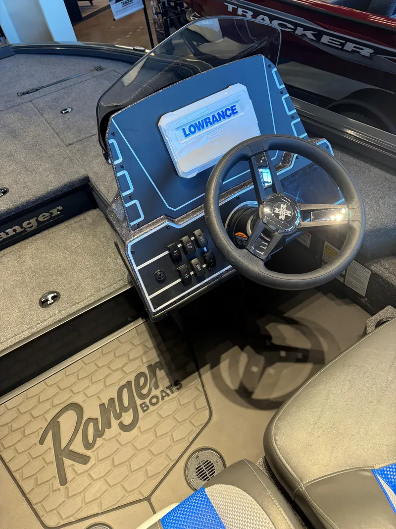 Slide: The Image of 2025 Ranger ALPHA 208 boat interior with steering wheel and Lowrance display. - 4