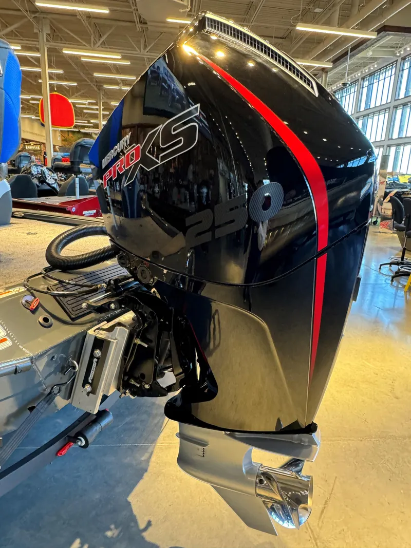 Slide: The Image of 2025 Ranger ALPHA 208 boat engine, black with red accents, displayed indoors. - 5