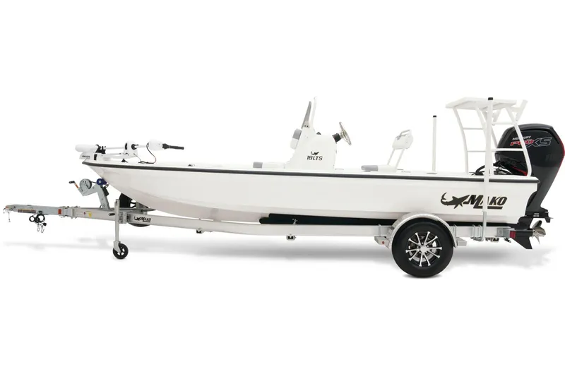 Slide: The Image of 2025 Mako 18 LTS boat on trailer, parked outdoors under clear sky. - 2