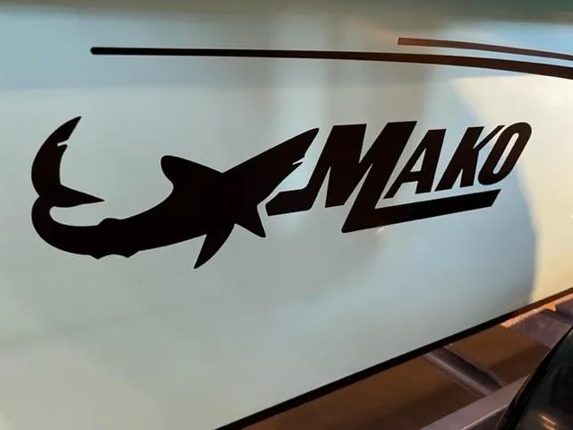 Slide: The Image of Logo of Mako Pro Skiff 17 CC, 2025 model, featuring a shark silhouette. - 2