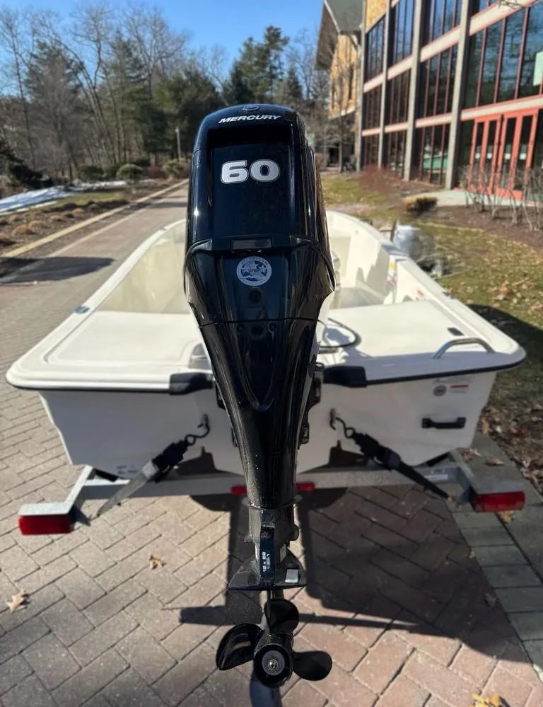 Slide: The Image of 2025 Mako Pro Skiff 15 CC with Mercury 60 engine on trailer. - 5