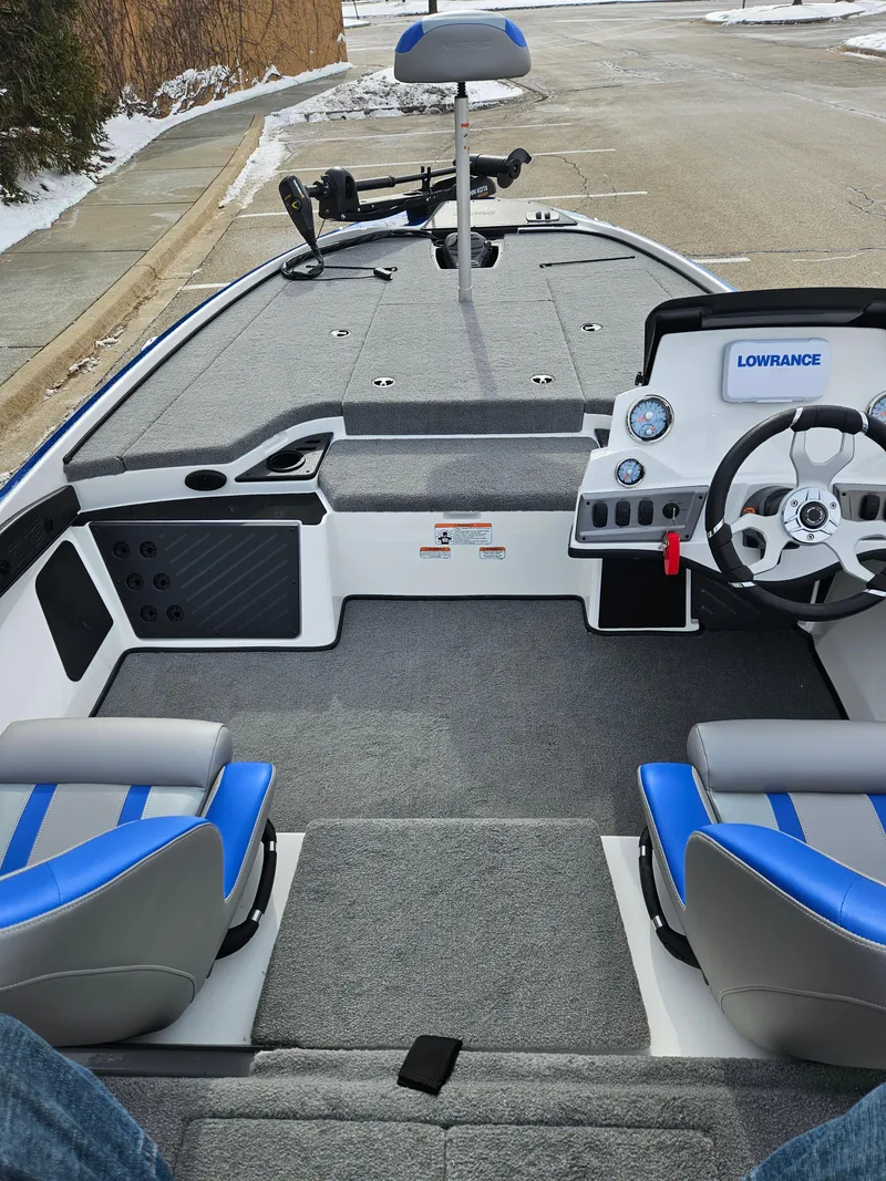 Slide: The Image of 2025 Nitro Z18 boat interior with blue seats and modern dashboard. - 3