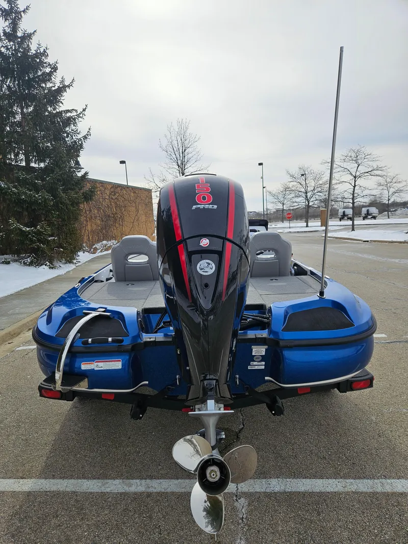 Slide: The Image of 2025 Nitro Z18 boat, rear view, parked outdoors, showcasing motor and seating. - 5