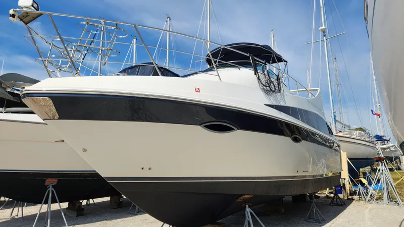 Slide: The Image of 2008 Carver 36 Mariner yacht on dry dock, blue sky background. - 0