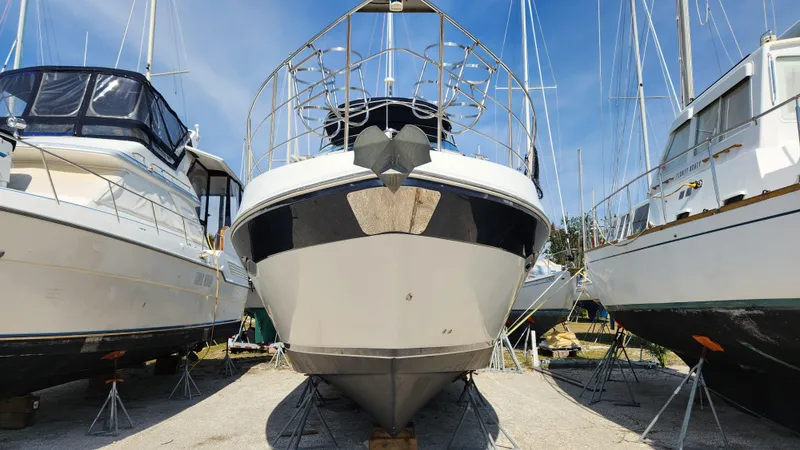 Slide: The Image of 2008 Carver 36 Mariner yacht on dry dock, surrounded by other boats. - 1