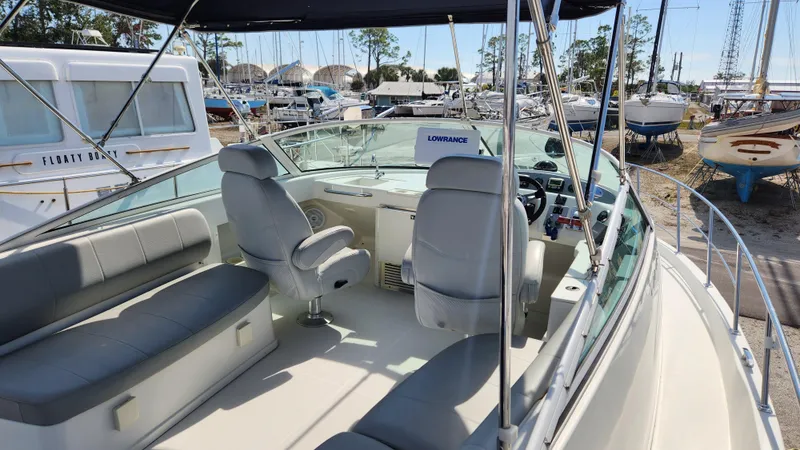 Slide: The Image of 2008 Carver 36 Mariner boat interior with seating and steering area. - 11