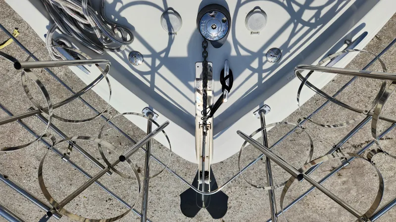 Slide: The Image of Bow view of 2008 Carver 36 Mariner yacht with stainless steel railings and anchor. - 13