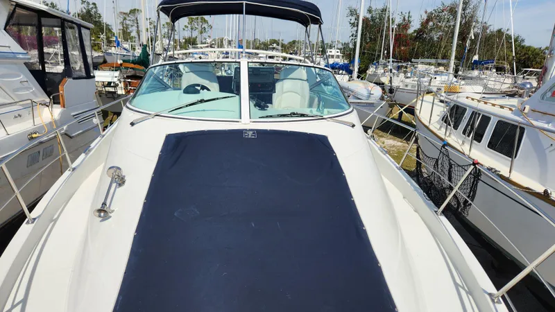 Slide: The Image of 2008 Carver 36 Mariner yacht docked among other boats at a marina. - 14