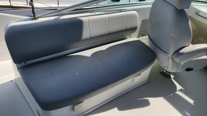 Slide: The Image of 2008 Carver 36 Mariner interior with gray seating and helm chair. - 17