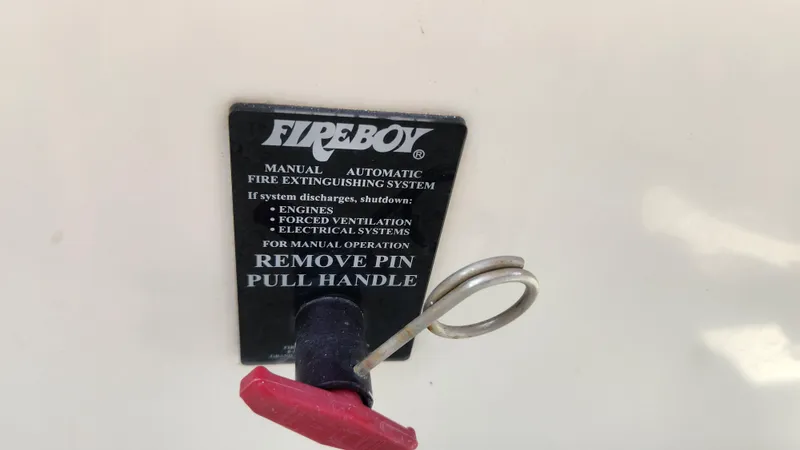 Slide: The Image of Fireboy fire extinguishing system handle on 2008 Carver 36 Mariner boat. - 25