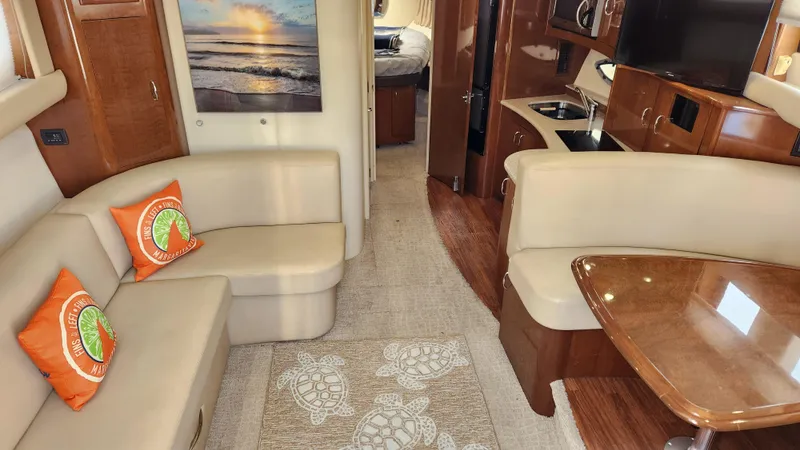 Slide: The Image of Interior of 2008 Carver 36 Mariner yacht with beige seating and wooden accents. - 30