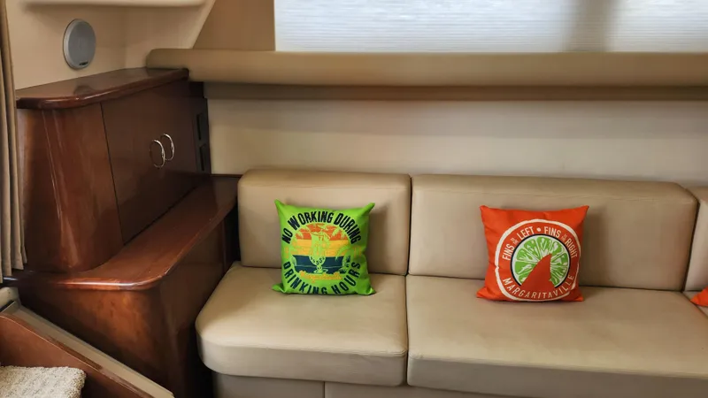 Slide: The Image of Interior of 2008 Carver 36 Mariner with decorative pillows on a beige sofa. - 33