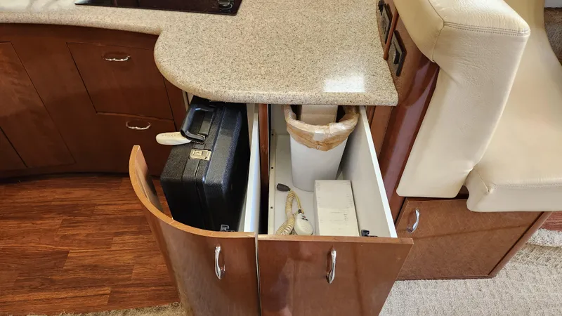 Slide: The Image of 2008 Carver 36 Mariner interior storage with open cabinet and countertop. - 39