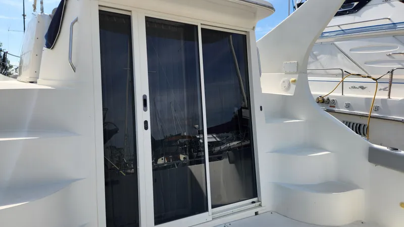 Slide: The Image of 2008 Carver 36 Mariner yacht with sliding glass doors and exterior steps. - 9
