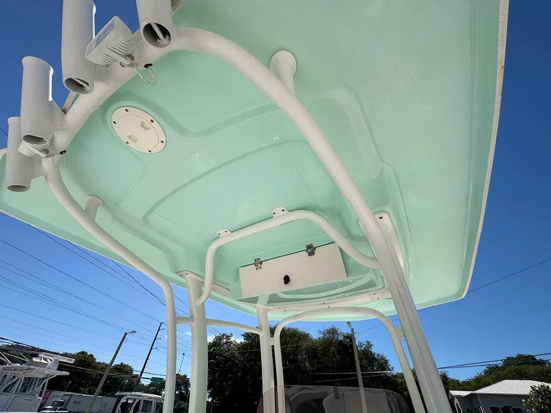 Slide: The Image of 2018 Robalo R222 Center Console boat T-top with rod holders, viewed from below. - 10