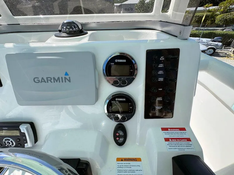 Slide: The Image of 2018 Robalo R222 Center Console dashboard with Garmin and Yamaha displays. - 12