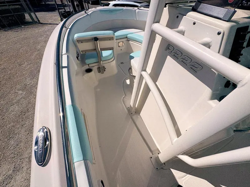 Slide: The Image of 2018 Robalo R222 Center Console boat interior with seating and console details. - 13