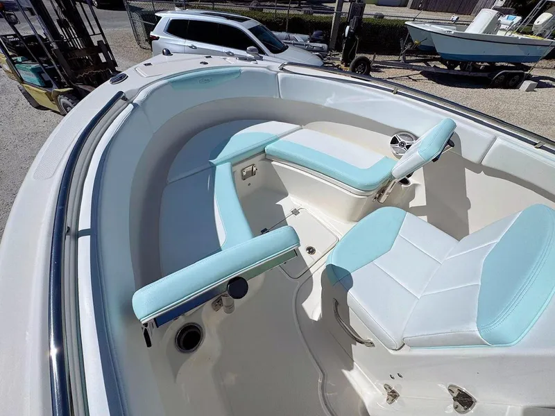 Slide: The Image of 2018 Robalo R222 Center Console boat with light blue seating and spacious deck. - 14