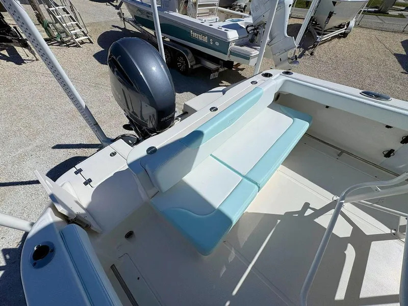 Slide: The Image of 2018 Robalo R222 Center Console boat with seating and outboard motor. - 6