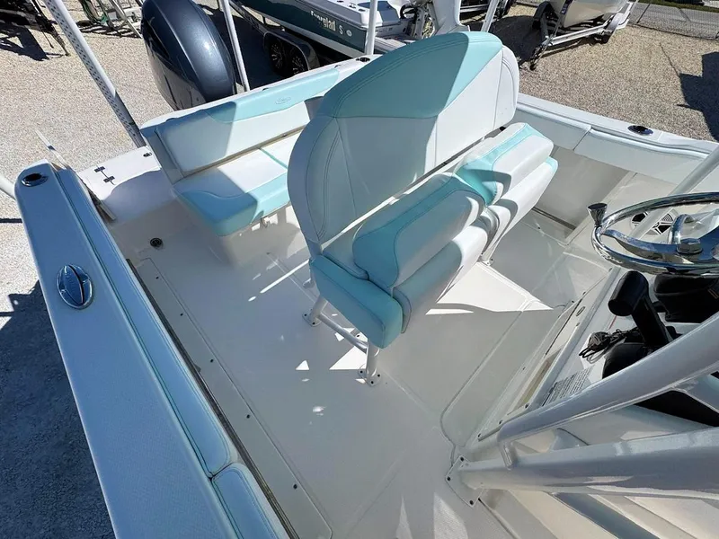 Slide: The Image of 2018 Robalo R222 Center Console boat interior with seating and steering wheel. - 7