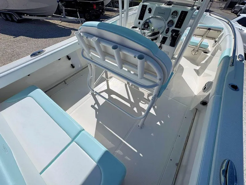 Slide: The Image of 2018 Robalo R222 Center Console boat interior with seating and control panel. - 8