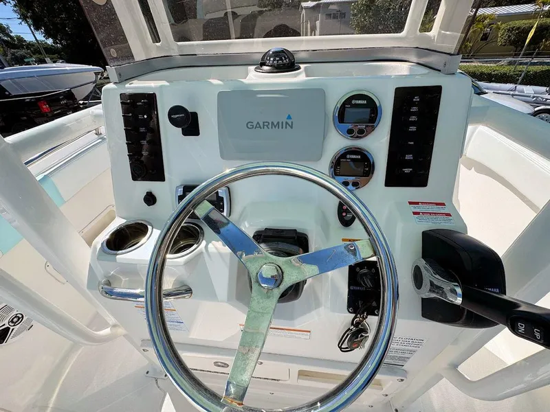 Slide: The Image of 2018 Robalo R222 Center Console dashboard with Garmin navigation and steering wheel. - 9