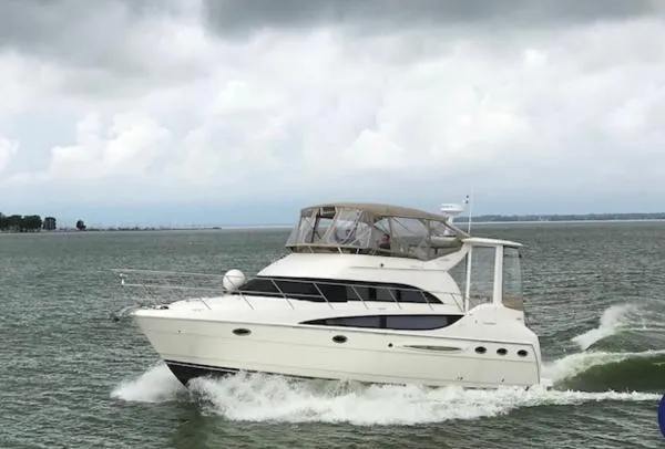Slide: The Image of 2007 Meridian 408 Motoryacht cruising on a cloudy day. - 2