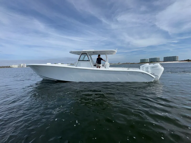 The Image of 2025 Yellowfin 39 Offshore boat on calm water under a cloudy sky. - 0