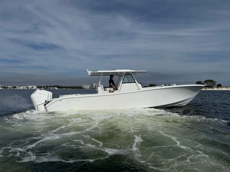 Slide: The Image of 2025 Yellowfin 39 Offshore boat cruising on open water. - 11