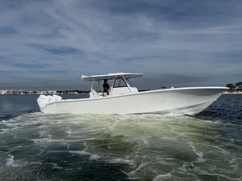 Slide: The Image of 2025 Yellowfin 39 Offshore boat cruising on open water. - 13