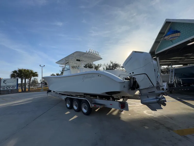 Slide: The Image of 2025 Yellowfin 39 Offshore boat on trailer in marina setting. - 34
