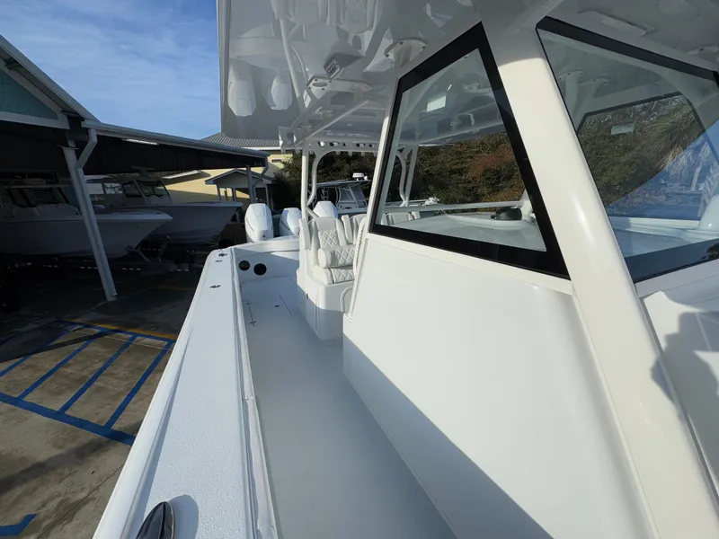 Slide: The Image of 2025 Yellowfin 39 Offshore boat in marina, showcasing sleek design and spacious deck. - 41