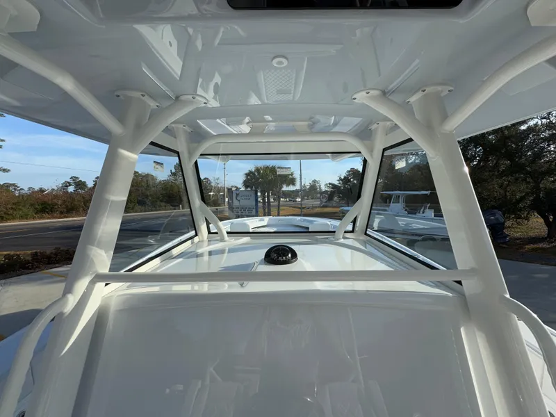 Slide: The Image of 2025 Yellowfin 39 Offshore boat interior with clear windows and sturdy framework. - 51